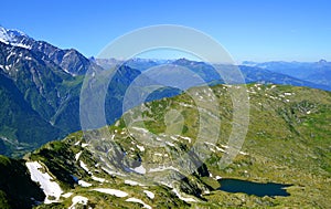 View from top of mountain Le Brevent on the lake Lac du Brevent. French Alps