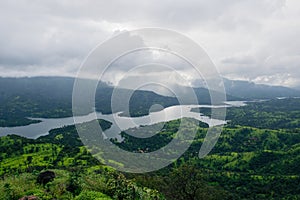 View from the top of a mountain of a river in India