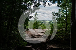 A view from the top of the Niagara Escarpment looking down at forest and farm fields