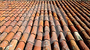 The view from the top of the old red-orange-brown tiles. The roof of the old house