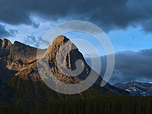 View of the top of popular hiking destination Ha Ling Peak near Canmore, Kananaskis Country, Alberta, Canada in the morning light.