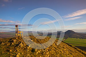 View from the top of Rana hill and wooden chair at sunrise.