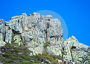 View of the top rocks of the ÃÂabski Szczyt mountain peak located in the Giant Mountains photo