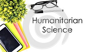 VIEW FROM THE TOP, TABLE WORKING WITH TEXT `HUMANITARIAN SCIENCE`