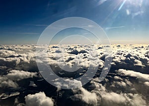 View from top to a lot of clouds in the sky