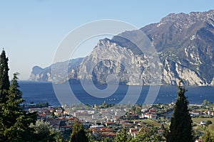 View of Torbole and the mountains on the shores of Lake Garda. Torbole am is a popular vacation spot in Northern Italy.