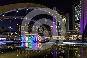 View of Toronto Sign on Nathan Phillips Square at night, in Toronto.