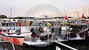 View on tourist boats or Dhow are parked at the pier. Musandam, Oman.