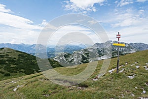 Tourist sign on mountain road, Alps