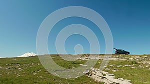 View of touristic car on plateau Bermamyth in sunny summer afternoon. Nature in Russia.