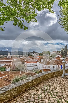 View of a touristic monocle fortress and Luso Roman castle of Ã“bidos, with buildings of Portuguese vernacular architecture and