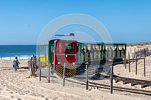 View on touristic train on Plage de Horizon, Plage de l'ocean near Le Phare du Cap Ferret and Duna du Pilat, Cap photo