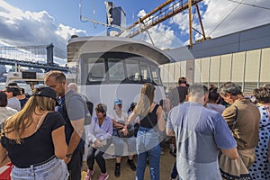 View of tourists on excursion boat near Brooklyn Bridge,  New York,