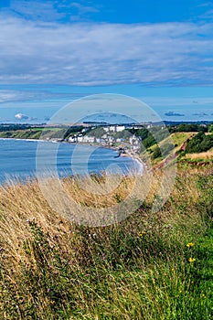 View towards Filey from Filey Brigg on a sunny morning with some cloud