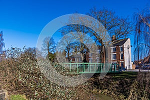 A view towards a footbridge over the River Welland opposite Welland Place in the centre of Spalding, Lincolnshire photo