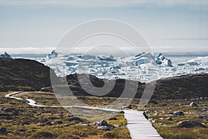 View towards Icefjord in Ilulissat. Easy hiking route to the famous Kangia glacier near Ilulissat in Greenland. The