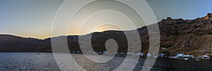 A view towards the island of Thirasia, Santorini as the sun sets