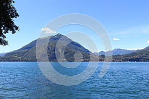 View towards lakeside city Bellagio at Lake Como with mountains in Lombardy