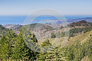 View towards the Pacific Ocean and Pillar Point Harbor from Purisima Creek Redwoods Park on a clear day, California