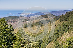 View towards the Pacific Ocean and Pillar Point Harbor from Purisima Creek Redwoods Park on a clear day, California