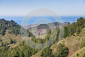 View towards the Pacific Ocean and Pillar Point Harbor from Purisima Creek Redwoods Park on a clear day, California