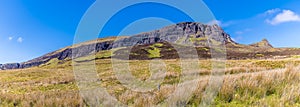 A view towards a rocky outcrop of the Quiraing Mountains on the Isle of Skye, Scotland