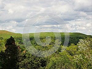 View  towards the sundial in green surroundings from the plateau of the Hoheward heap, modulated meadows and open spaces