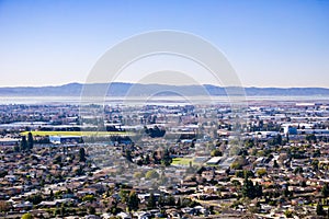 View towards the towns of east bay; San Mateo bridge on the background, San Francisco bay area, Hayward, California