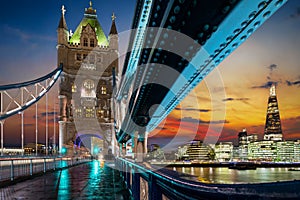 View from the Tower Bridge to the illuminated skyline of London