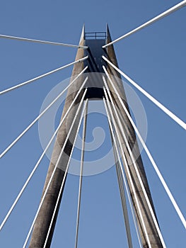 view of the tower and cables on the marine way suspension bridge in southport merseyside against a blue summer sky
