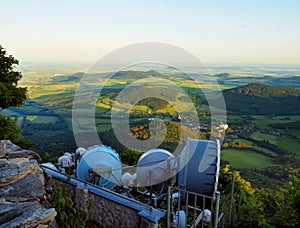 View from tower of meteorological observatory with many parabolic satellites to morning countryside. Spring morning