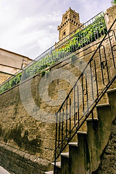 View on the tower in Pitigliano over the tuf wall and stairs photo