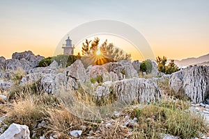 View of tower of Sveti Petar lighthouse at Makarska, Croatia. Beautiful sunset