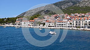 View of the town of Bol on the island of Brac in Croatia from a moving ship in the Adriatic Sea