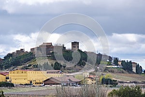 View of the town of Guardia in Alava, Spain. Surrounded by vineyards of the Rioja and wineries. Highlights the abbey tower of the