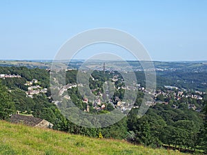 View of the town of halifax from high west yorkshire countryside surrounded by trees fields and nearby villages