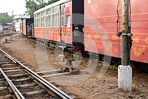 View of Toy train coach from the middle of railway track during daytime near Kalka railway station in India, Toy train coach view photo