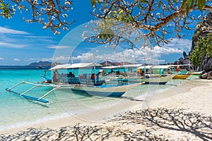 View of traditional boats at Coron Island beach, Philippines.