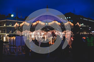 View of traditional famous annual Christmas Market in Senate Square of Helsinki, Finland, with kiosks, decoration, gifts and