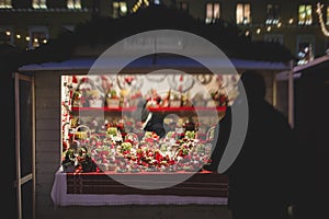 View of traditional famous annual Christmas Market in Senate Square of Helsinki, Finland, with kiosks, decoration, gifts and