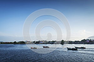 View of traditional fishing boats on kampot river cambodia