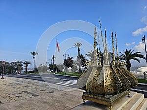 view of Traditional Moroccan golden decorations with the street view at the Mausoleum of Mohammed V is a historical building