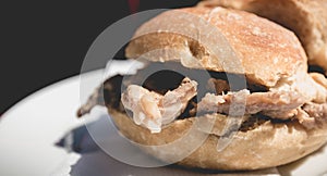 View of traditional portuguese pork beef sandwich bifana photo