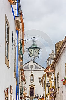 View of a traditional street lamp, Portuguese vernacular buildings on medieval village inside the fortress and Luso Roman castle