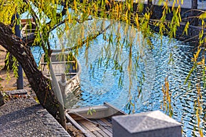 View of traditional wooden boat docked on the river bank