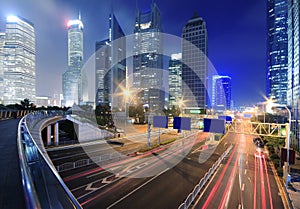 View traffic through modern city at night in shanghai