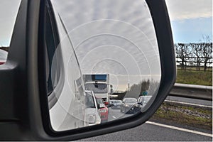 View of traffic from rear view mirror