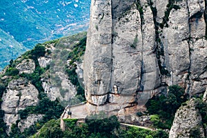 View of trail  atop the trainline platform above  Cathedral at Santa Maria de Montserrat abbey in Monistrol, Catalonia, Spain