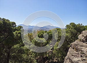 A View from the Trail to El Santo Peak at Pizarra, on a hot April afternoon looking over the wide Valley to the Mountains beyond. photo