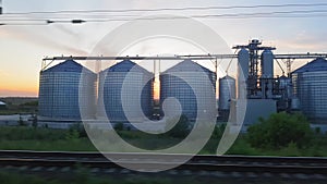 The view from the train on the beautiful scenery with hills and forest before sunset. The view from the window of the